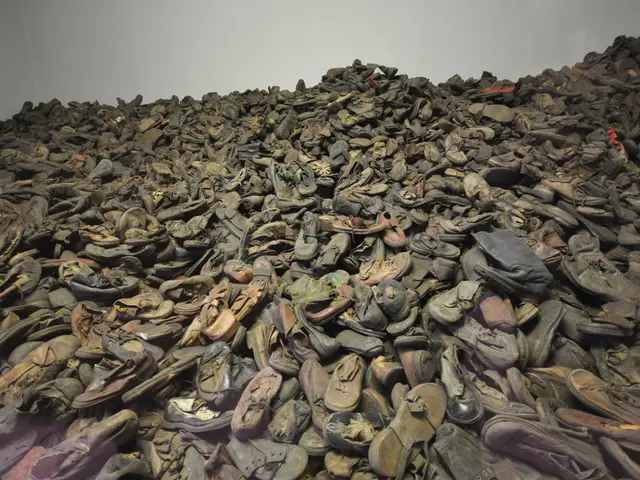 Which first-class students in Kazakhstan will receive educational supplies, footwear, and uniforms?