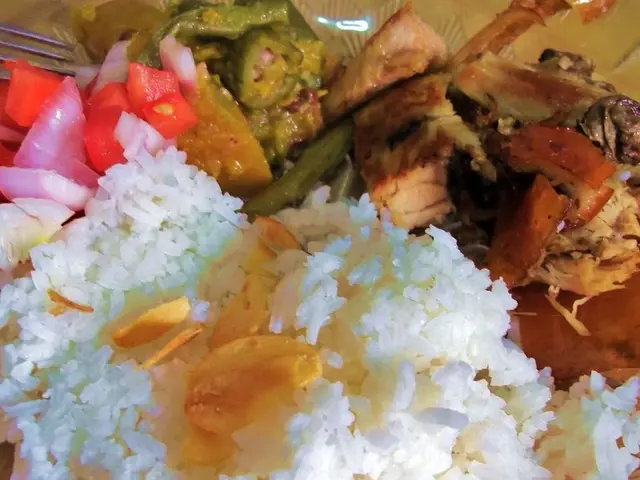 Here I can see a plate which consists of some food items in it. Along with the food there is a...