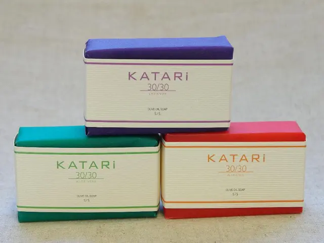 In this image there are three soap boxes of different colors. Two soap boxes are on the floor. On...