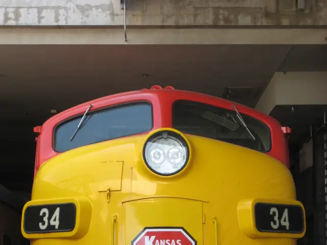 In this image, we can see a train engine. There is a ceiling at the top of the image.