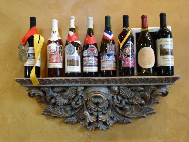 This picture shows few wine bottles on the shelf and we see a medal on the bottle and we see light...
