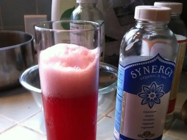 This is a picture where we have some bottles, bowl and a glass in which there is a drink.