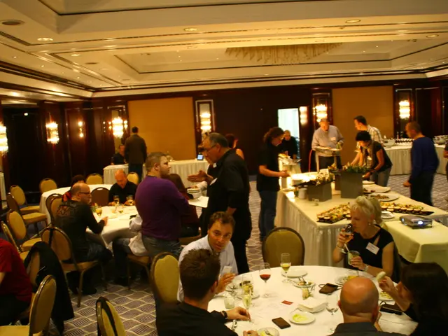 In this image there is restaurant, in that there are tables, around the tables there are chairs, in...